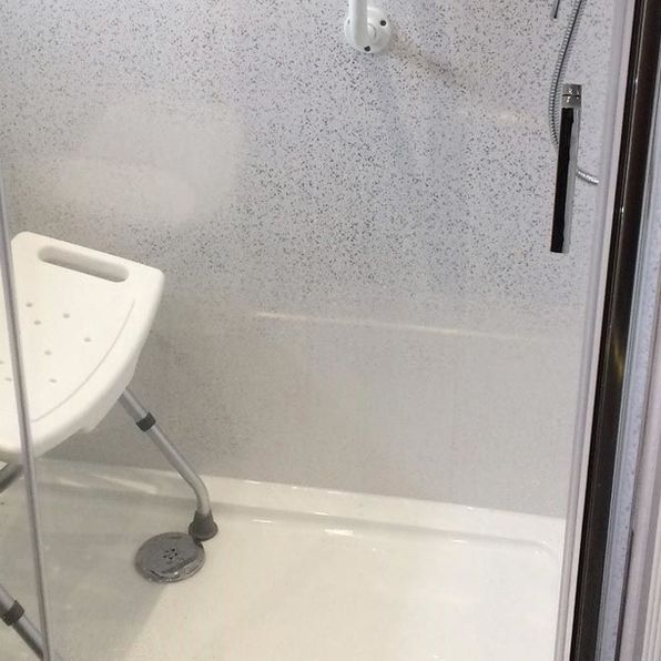 extra larger shower cubicle with enclosure for disabled access plus handrails